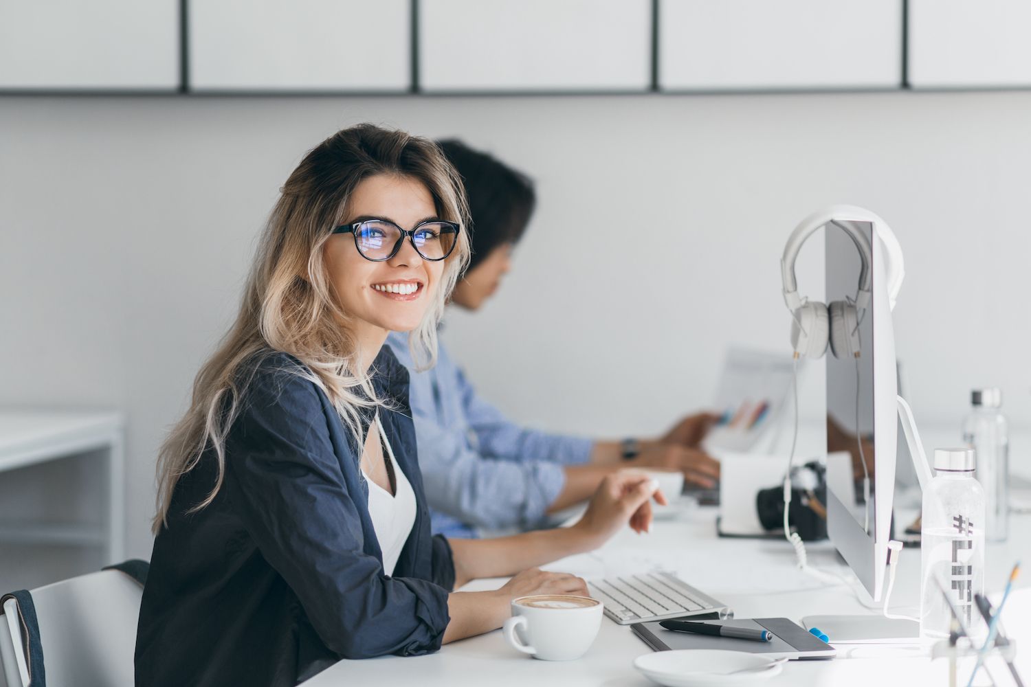 Man and woman looking over a laptop